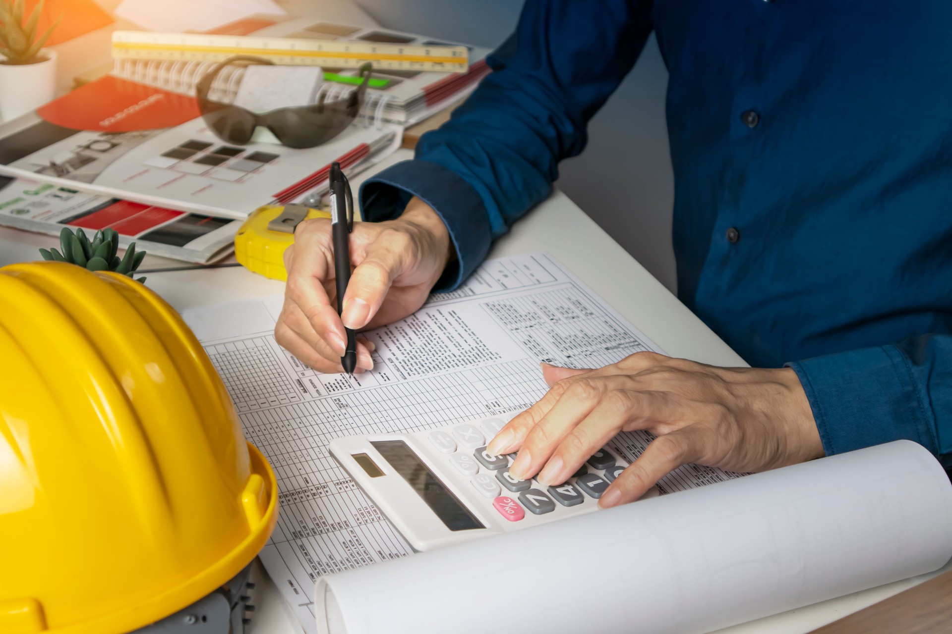 Engineers sit and work on building design and system work.,construction work safety,construction business and real estate